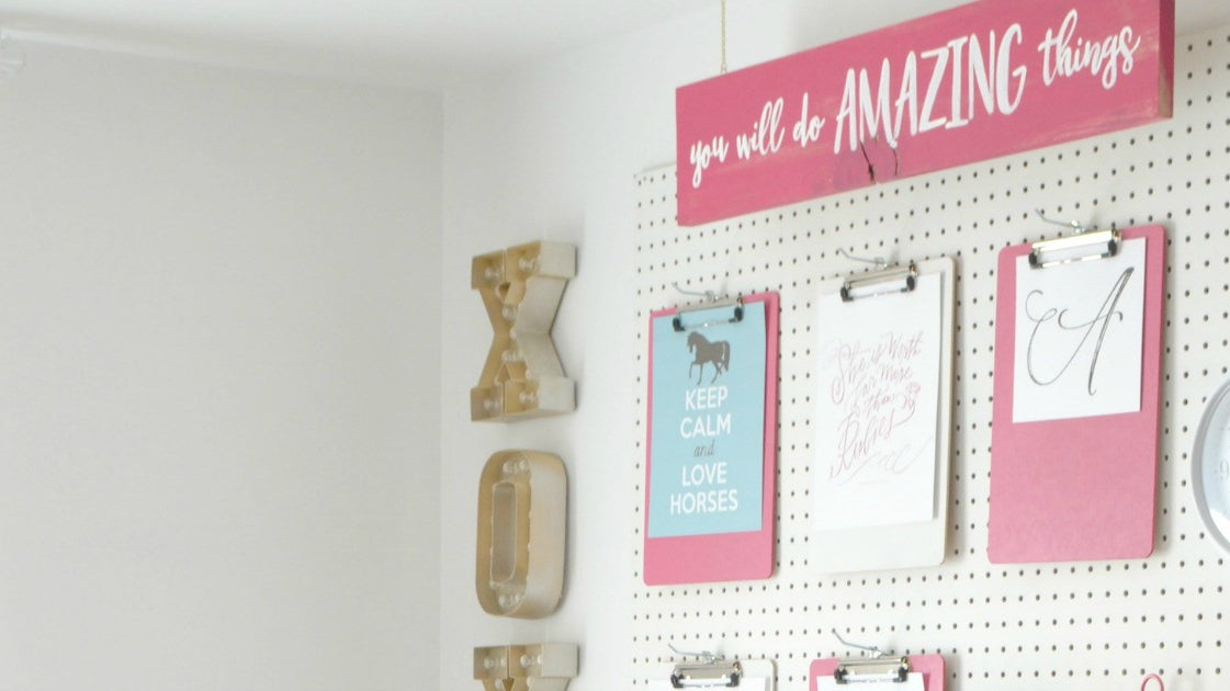 A peg board for the girls' room